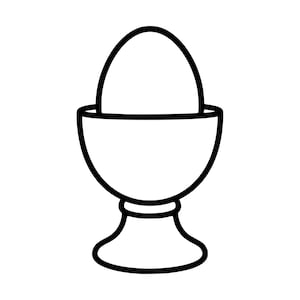 May include: A black and white line art illustration of a single egg resting inside a stemmed egg cup. The design features a simple, clean outline of the oval-shaped egg sitting within the rounded bowl of the cup, which has a flared base.