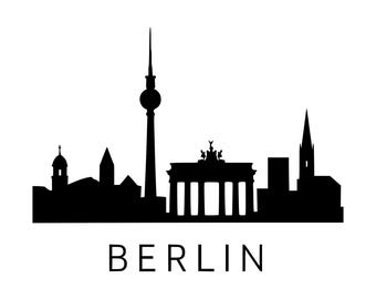 May include: A black silhouette graphic of the Berlin skyline featuring the TV Tower and the Brandenburg Gate, with the word BERLIN printed in a simple, clean, sans-serif font centered directly underneath the architectural structures.
