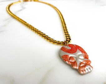 Pearlescent White Skull with Orange Snake Silkscreen Pendant on Gold Plated Curb Chain | Polymer Clay Halloween Skull Pendant Necklace
