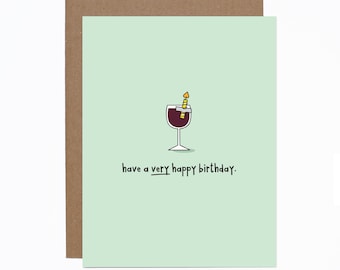 May include: A green card with a glass of red wine with a lit candle on top. The text on the card reads "have a very happy birthday."
