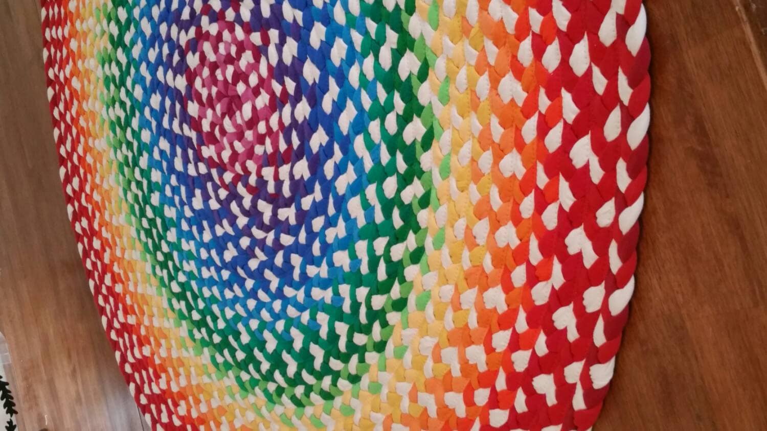 rainbow braided rug created from new and recycled t shirts