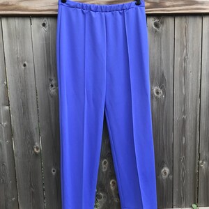 waist band about 15 inches wide,  inseam to side about 14 inches wide. Condition: This pair of pants are in usable vintage general condition with stains, fading, loose threads and pilling but does have several pulled threads or balls of thread.