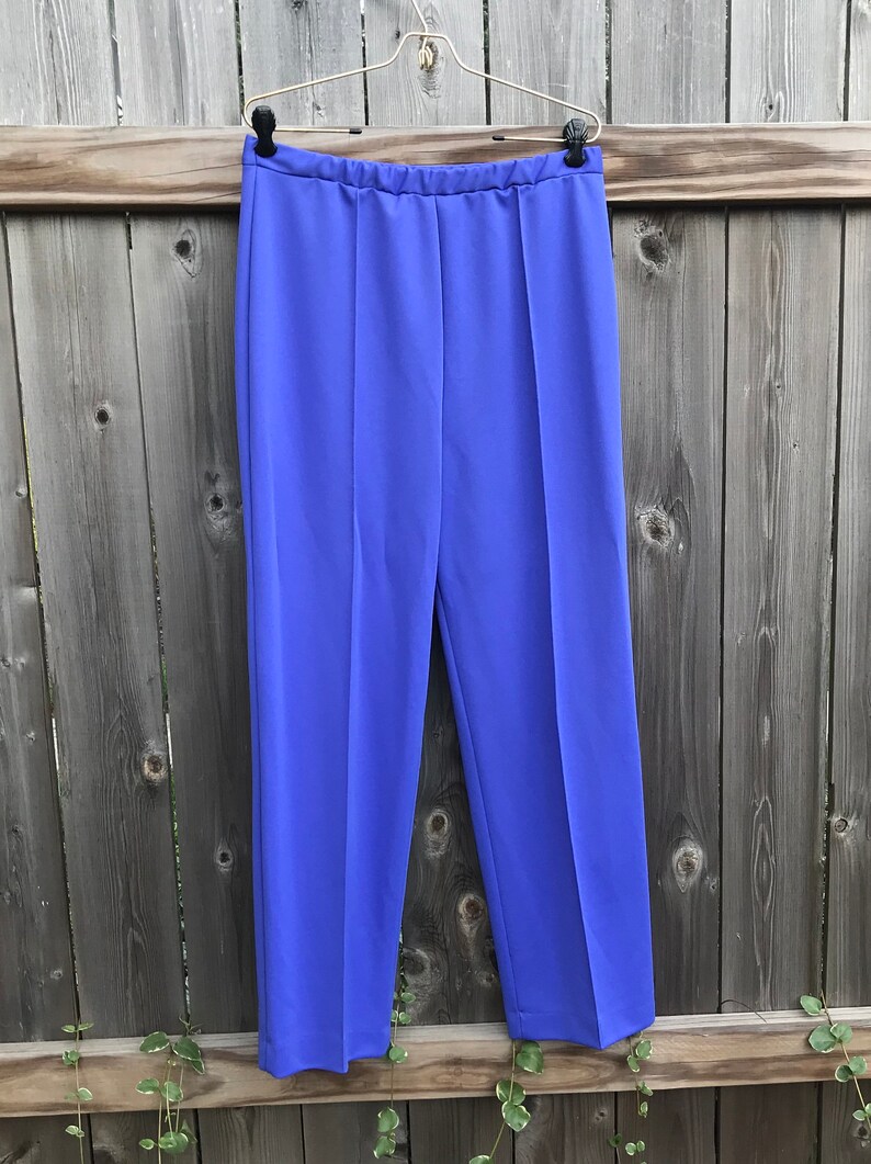 waist band about 15 inches wide,  inseam to side about 14 inches wide. Condition: This pair of pants are in usable vintage general condition with stains, fading, loose threads and pilling but does have several pulled threads or balls of thread.