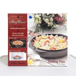 May include: A box for a Nordic Ware Any Oven baking pan. The box is red and white with text and images of the pan in use. The pan is non-stick and oven and microwave safe. The pan is 9 inches and 1.5 quarts.