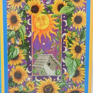 May include: A colorful illustration featuring a smiling sun, sunflowers, birds, and a birdhouse against a purple background with stars and crescent moons. The artwork is framed with a blue and yellow border.