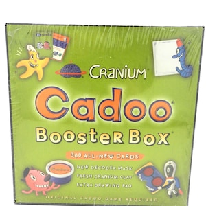 cranium cadoo booster box 2002 for : Toys & Games Giggling and Grinning Cranium Cadoo Lunchbox Tin Edition Includes a Game Board Cranium Cadoo Game Booster Box