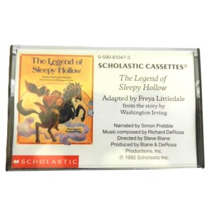 May include: A Scholastic cassette tape featuring the story "The Legend of Sleepy Hollow" by Washington Irving. The cassette tape is black with a white label and features a colorful illustration of a man riding a horse.