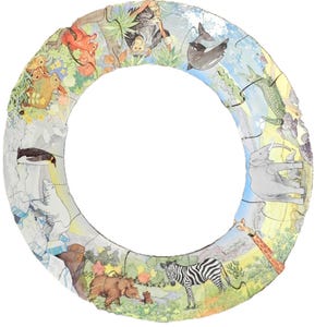 May include: A circular jigsaw puzzle featuring a variety of animals in a colorful, illustrated design. The puzzle includes a zebra, giraffe, bear, penguin, and other animals. The puzzle is made of multiple pieces and has a white background.