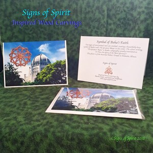 May include: A wooden carving of a nine-pointed star, a symbol of the Baha'i Faith, with the text "The Greatest Name" in the center. The carving is displayed in front of the Baha'i Temple in Wilmette, Illinois. The text "Signs of Spirit Inspired Wood Carvings by Mark Cooper and Katrina Hoffman" is also visible.