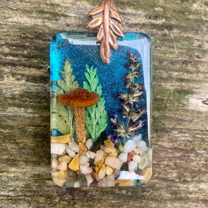 Handmade real mushroom, flowers and plants resin necklace. Keikosbeadbox