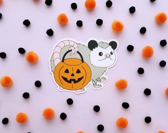 Trick-or-Treat Possum vinyl sticker // possum holding jack-o-lantern bucket // weatherproof