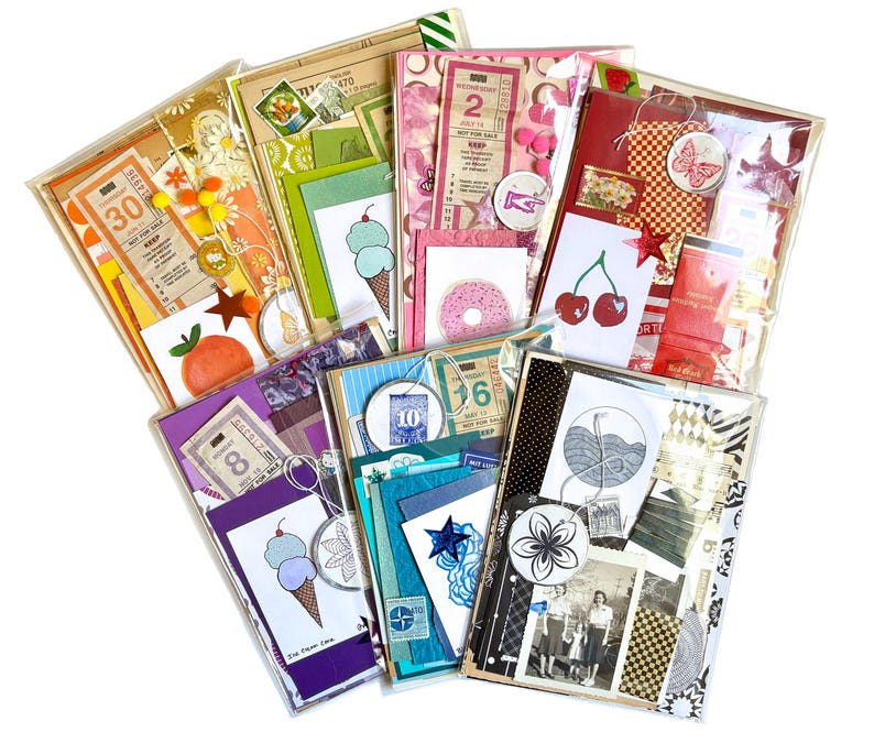 Mystery ephemera packets in Orange, Green, Pink, Red, Purple, Blue and Black with vintage texts, decorative papers, art prints, matchbook covers, vintage SF muni paper transfers, and stickers.