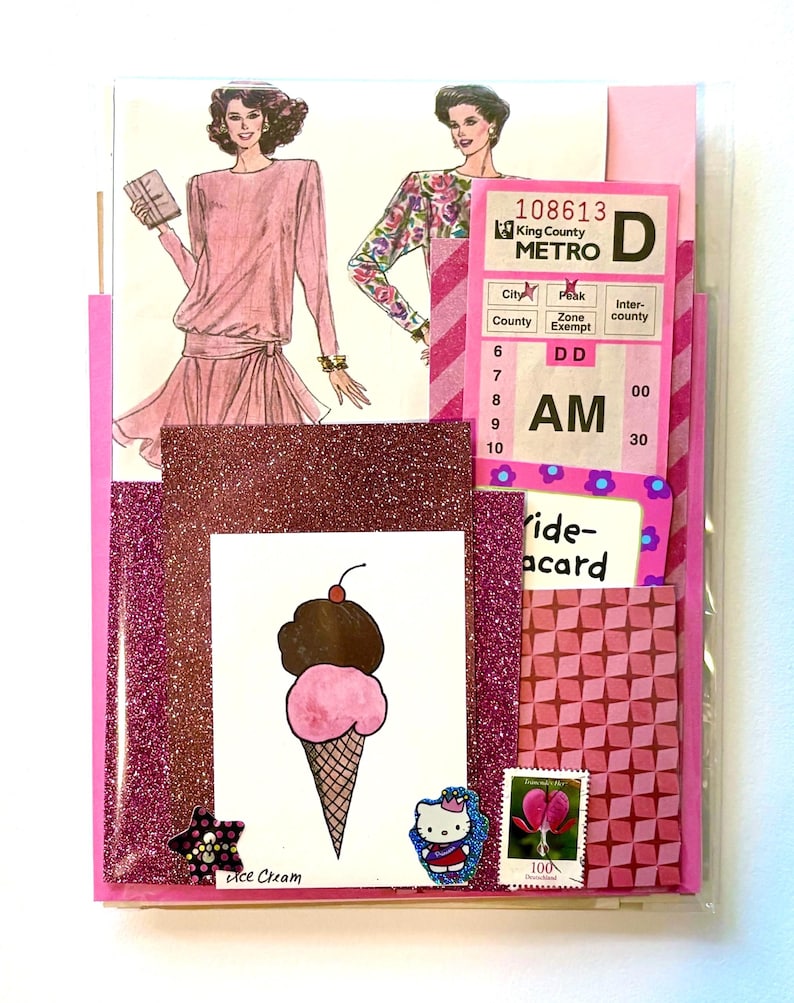 Mystery ephemera pack in Pink, showing vintage texts, sewing pattern pictures, decorative papers, art print with pink ice cream, vintage paper bus transfer, cancelled postage stamp, and stickers.