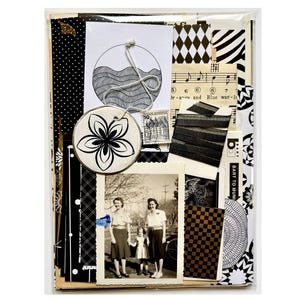 Mystery ephemera pack in Black and White, showing sheet music, decorative papers, art print with waves, vintage photo, black ribbon, and stickers.