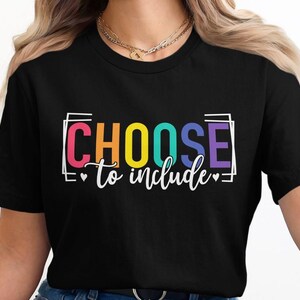 May include: Black t-shirt with the text "CHOOSE to include" in rainbow colors within a white box.