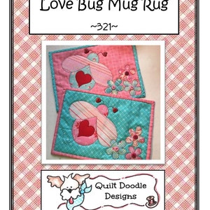 May include: Two quilted mug rugs with a love bug design. Each rug features a pink or teal background with a heart, wings, and flower accents. The text "Love Bug Mug Rug" is at the top.