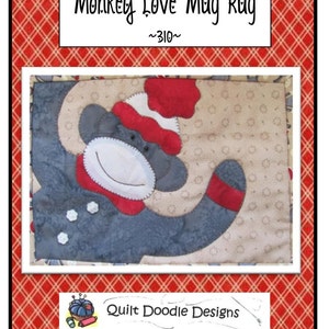 May include: A gray and red monkey mug rug with a white hat and a red bow tie. The rug is made of fabric and has a quilted design. The text "Monkey Love Mug Rug" and "~310~" is printed on the image. The text "Quilt Doodle Designs" is also printed on the image.