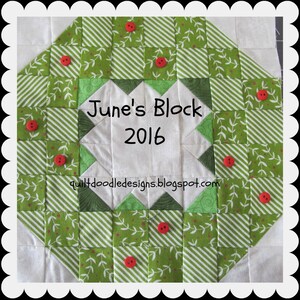 May include: A green and white quilt block with a white center that says "June's Block 2016" and the website "quiltdoodledesigns.blogspot.com". The block is surrounded by a border of green and white squares with red buttons.