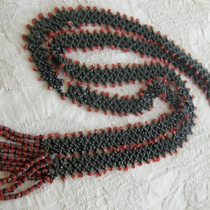 Vintage woven-bead flapper style necklace from the 1920s in red and black - needs minor repair