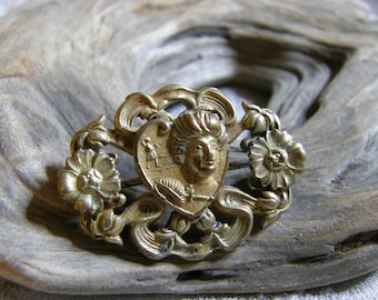 Vintage gilt Art Nouveau style brooch with heart and flowers circa the 1920's