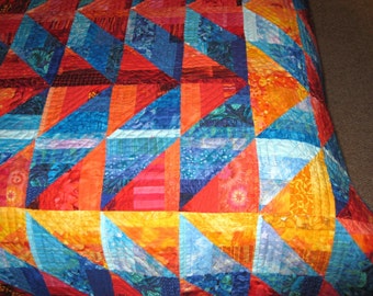 Quilt -- Orange and Gold Arrows against Blue Diamonds