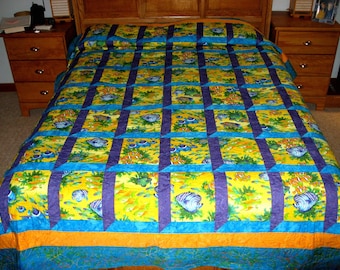 Quilt -- Attic Windows Pattern in Yellow Orange Purple and Blue Fish Fabric