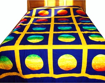 Queen Sized Quilt Portholes in Rainbow Color Gradation on Cobalt Background