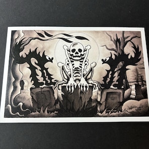 May include: A black and white illustration of a skeleton sitting on a tombstone in a graveyard. Two shadowy figures stand on either side of the skeleton. The background is a dark grey with a full moon.