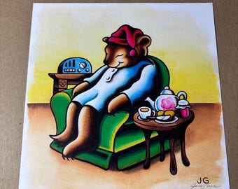May include: Illustration of a bear in pajamas and a nightcap, relaxing in a green armchair. A small table holds a teapot, teacup, and jam. A vintage radio sits on a side table. The artwork has a warm, inviting color palette.