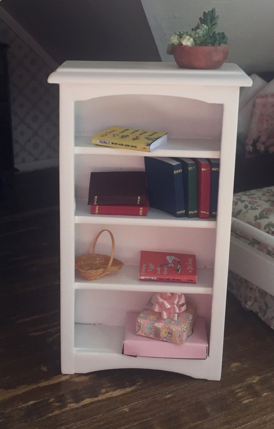 white bookshelf with toy storage