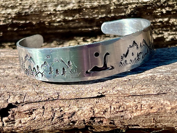 Whimsical Loch Ness Monster hand-stamped tapered aluminum cuff bracelet, Scottish Lore Nessie jewelry