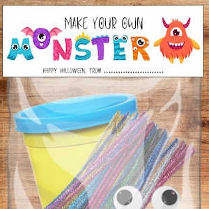 May include: A clear plastic bag containing a yellow container with a blue lid, colorful pipe cleaners, and googly eyes. The bag has a label that reads "MAKE YOUR OWN MONSTER" with monster-themed letters and illustrations. The text "HAPPY HALLOWEEN, FROM" is also visible.