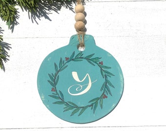 Free shipping - wood ornament. Size is 3x3.personalize with your last name initial. Let me know at checkout the initial.