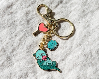 Aqua Sea Otter Keychain | Glow-in-the-Dark | Gold Key Fob