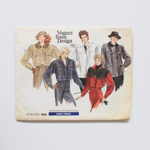 May include: A vintage Vogue's Basic Design 1987 sewing pattern. The cover shows illustrations of five jacket designs. The drawings depict women wearing jackets in tan, white, grey, blue, and red. The text reads 'EASY / FACILE'.