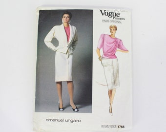 May include: Vogue Patterns Paris Original sewing pattern 1766 by Emanuel Ungaro featuring a white skirt suit and a pink blouse.