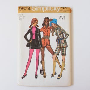 May include: A vintage Simplicity sewing pattern, number 9574, with illustrations of three women in 1970s outfits. The cover includes the year 1971, size 8, bust 80 cm, and waist 58 cm.