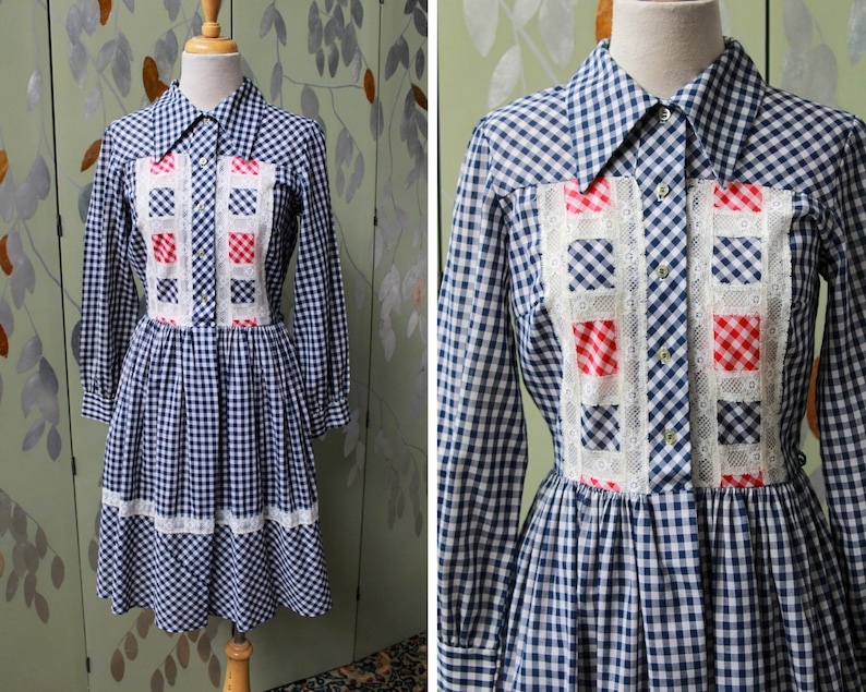 1970s blue white gingham check button up shirt dress with large collar, red and white contrast check patchwork squares and lace border on front, gathered skirt, long sleeves coastal cowgirl