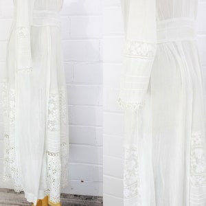 edwardian cotton lawn dress with ruffle collar, loop embroidered trim on sleeves and v neckline, floral embroidered skirt, long sleeves, maxi length, hooks and eyes closure  antique bridal dress