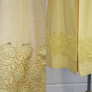 May include: Two yellow dresses with a lace trim. The lace is a delicate floral pattern.