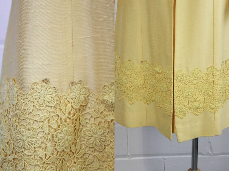 May include: Two yellow dresses with a lace trim. The lace is a delicate floral pattern.