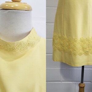 1960s yellow dress and jacket set vintage alfred werber mock neck and hem close up
