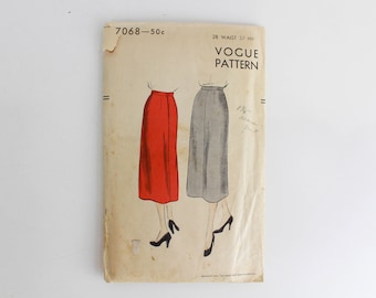 May include: Vintage Vogue sewing pattern for a skirt, pattern number 7068, size 28 waist, 37 hip. The pattern shows two illustrations of a skirt, one red and one gray.