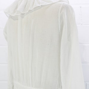 edwardian cotton lawn dress with ruffle collar, loop embroidered trim on sleeves and v neckline, floral embroidered skirt, long sleeves, maxi length, hooks and eyes closure  antique bridal dress