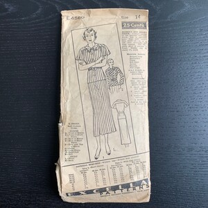 May include: A vintage sewing pattern for a women's dress with a striped skirt and a short-sleeved blouse. The pattern is from the Excella Pattern Company and is for size 14. The pattern is printed on a white background with black text and illustrations. The pattern is titled "E4560" and costs 25 cents.