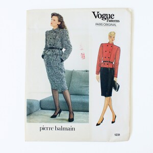 May include: Vogue Patterns Paris Original sewing pattern for a skirt suit by Pierre Balmain. The pattern shows a black and white tweed skirt suit and a red skirt suit with a black skirt. The pattern number is 1231.
