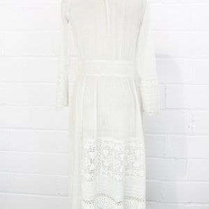 edwardian cotton lawn dress with ruffle collar, loop embroidered trim on sleeves and v neckline, floral embroidered skirt, long sleeves, maxi length, hooks and eyes closure  antique bridal dress