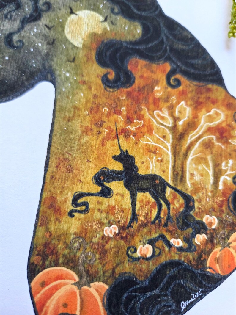 May include: Wooden art piece featuring a black unicorn silhouette in a forest scene with pumpkins. The artwork has a warm color palette of orange, yellow, and brown, with a full moon and dark hair details.