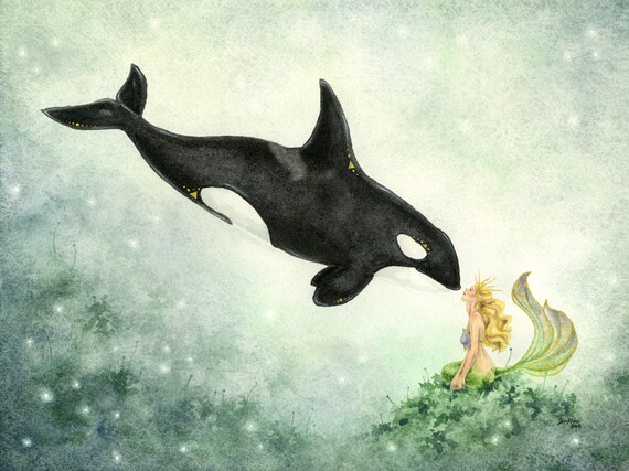 Mermaid swimming with an orca whale