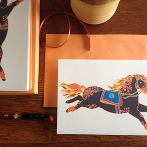 May include: A white card with a colorful illustration of a black horse with orange and yellow flames for a mane and tail. The horse is wearing a blue and orange saddle with a circular design. The card has the text "HORSE" in black lettering in the bottom right corner.